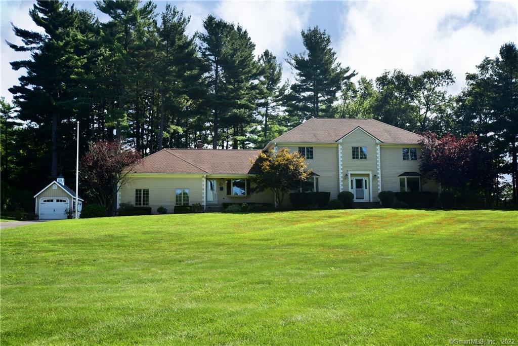 Stately colonial set on park like yard