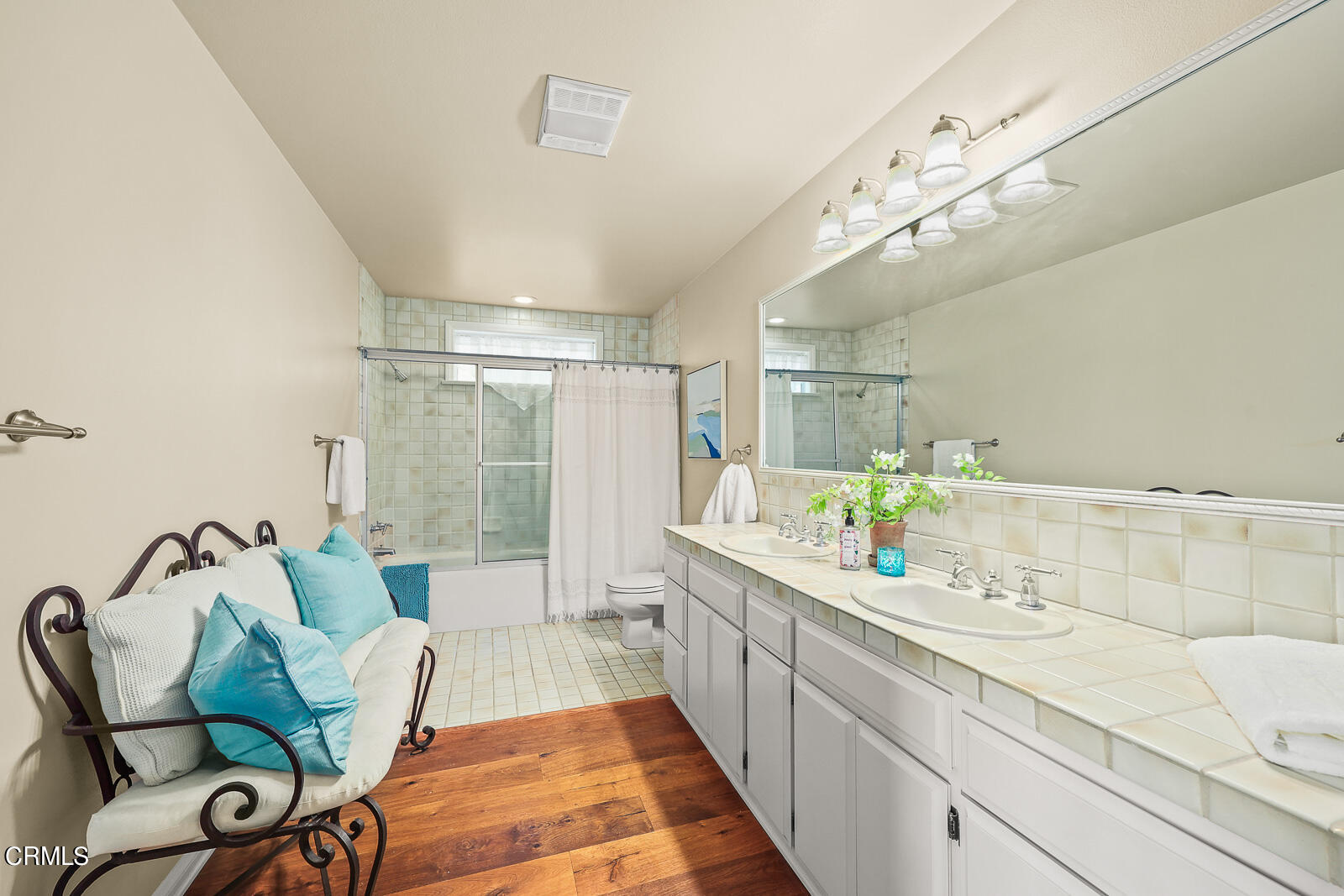 Undisclosed Address Burbank, CA 91501 - Photo 40 of 70 a spacious bathroom with a double vanity sink and a large mirror