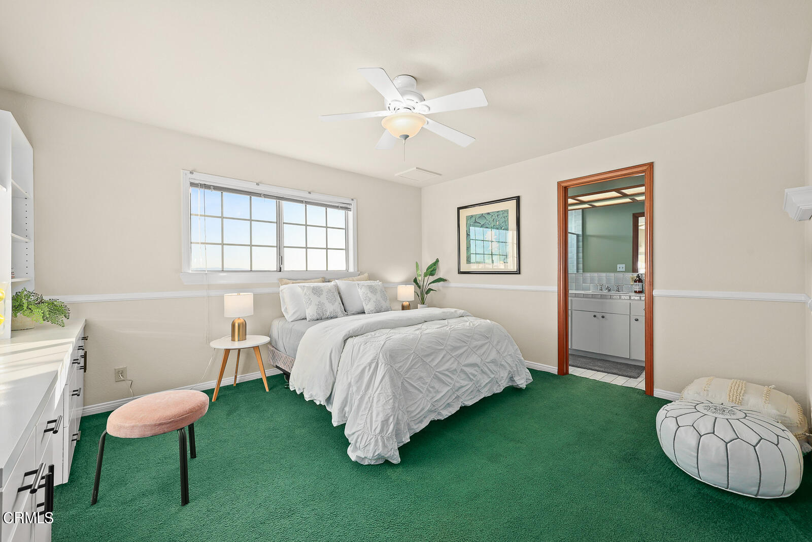 Undisclosed Address Burbank, CA 91501 - Photo 42 of 70 a spacious bedroom with a bed and a chair