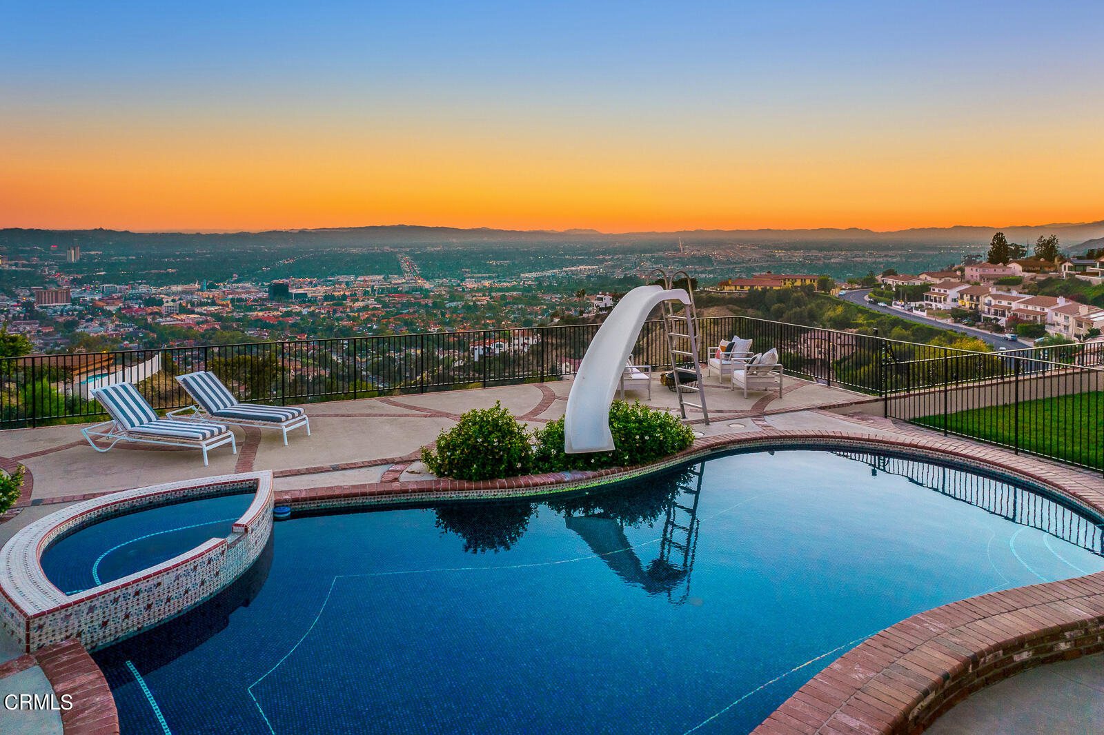 Undisclosed Address Burbank, CA 91501 - Photo 51 of 70 a view of a swimming pool with a lounge chair and a lake view
