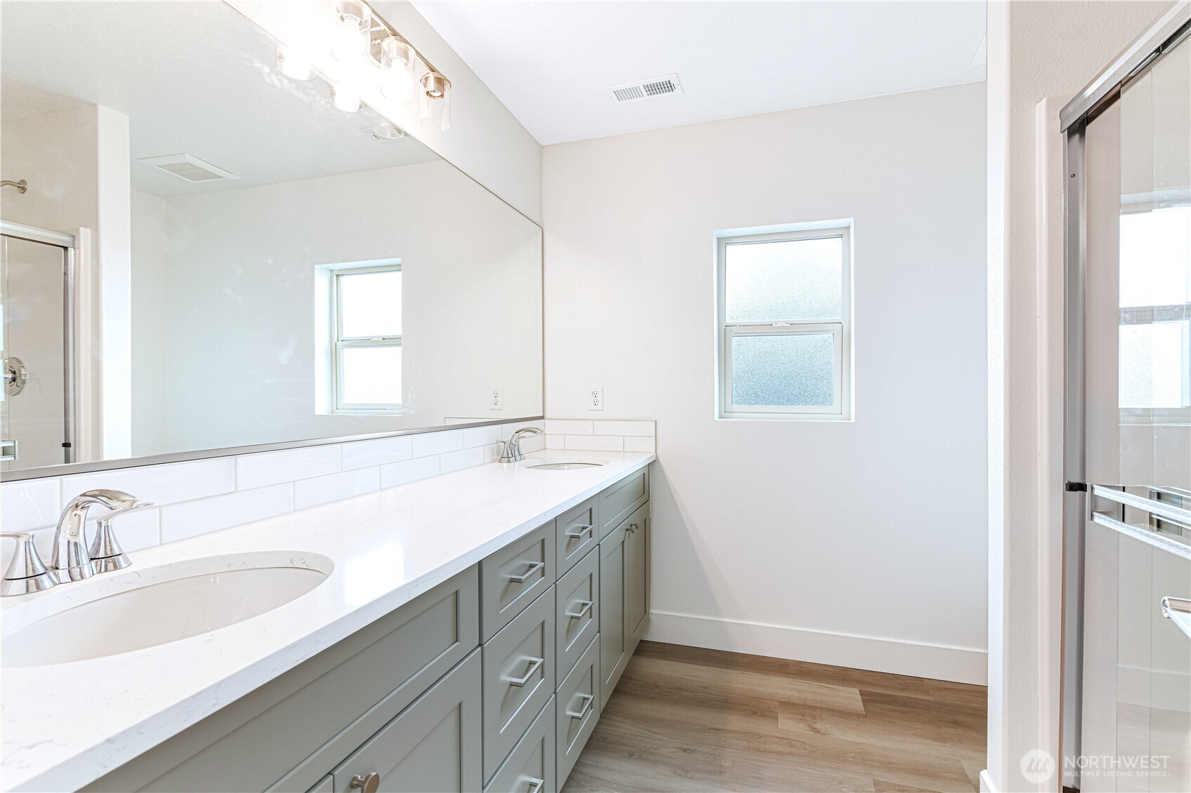 308 North Sandy Loop Moses Lake, WA 98837 - Photo 14 of 18 a bathroom with a double vanity sink and a mirror