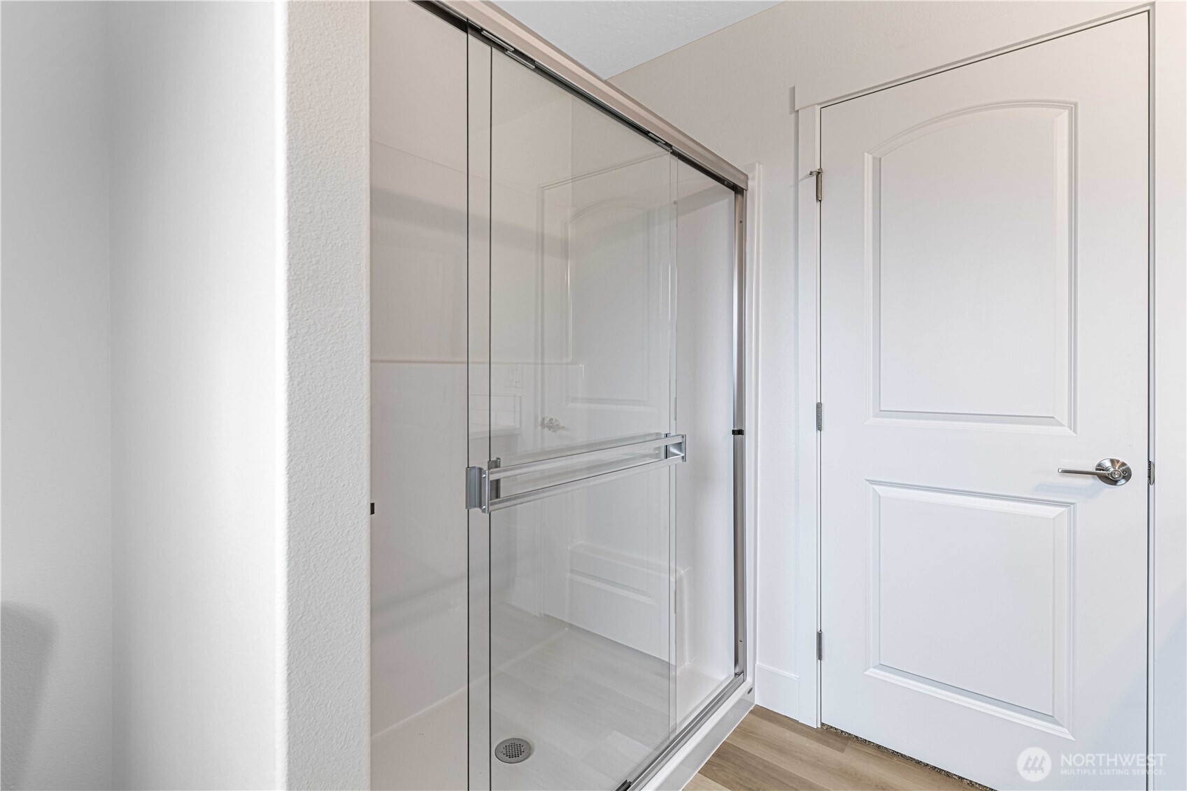 308 North Sandy Loop Moses Lake, WA 98837 - Photo 15 of 18 a bathroom with a glass shower door