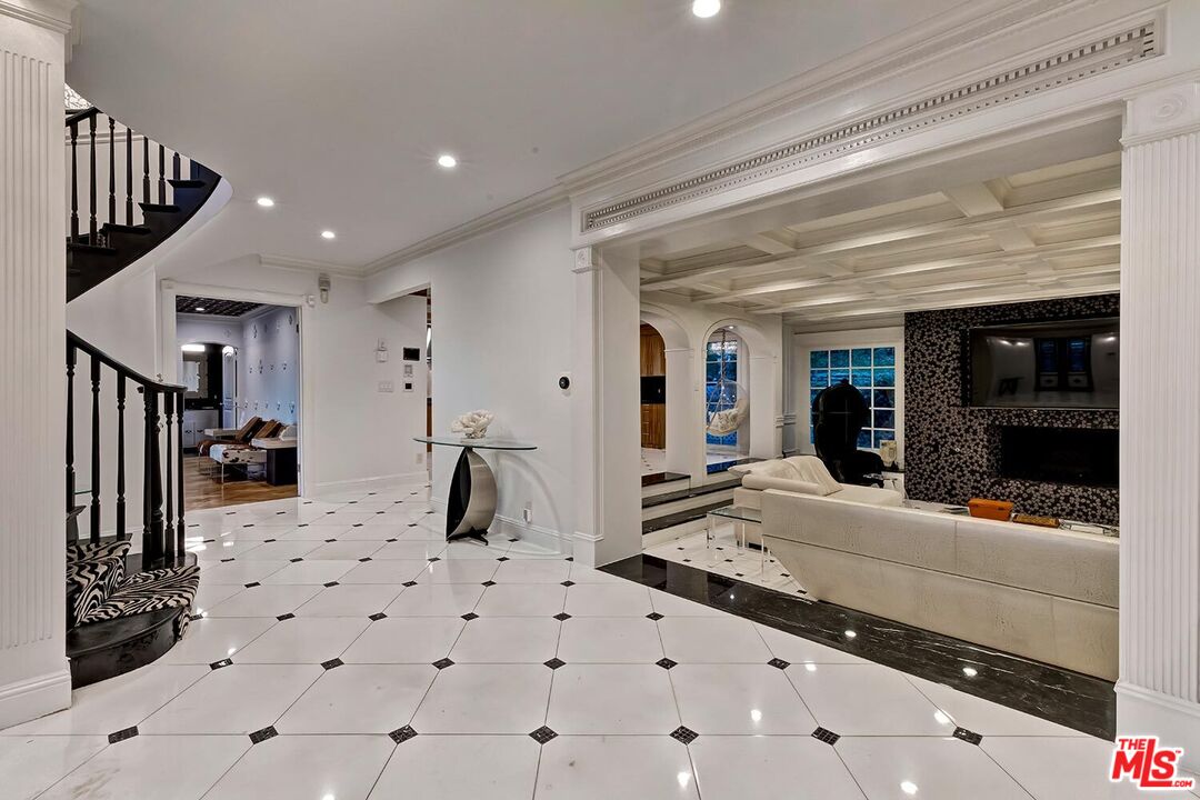 725 North Faring Road Los Angeles, CA 90077 - Photo 13 of 56 a living room with kitchen island granite countertop furniture and a large window