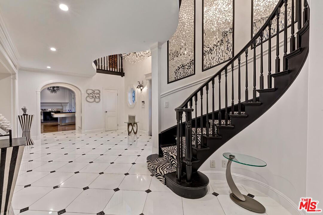 725 North Faring Road Los Angeles, CA 90077 - Photo 14 of 56 a view of entryway and hall with wooden floor