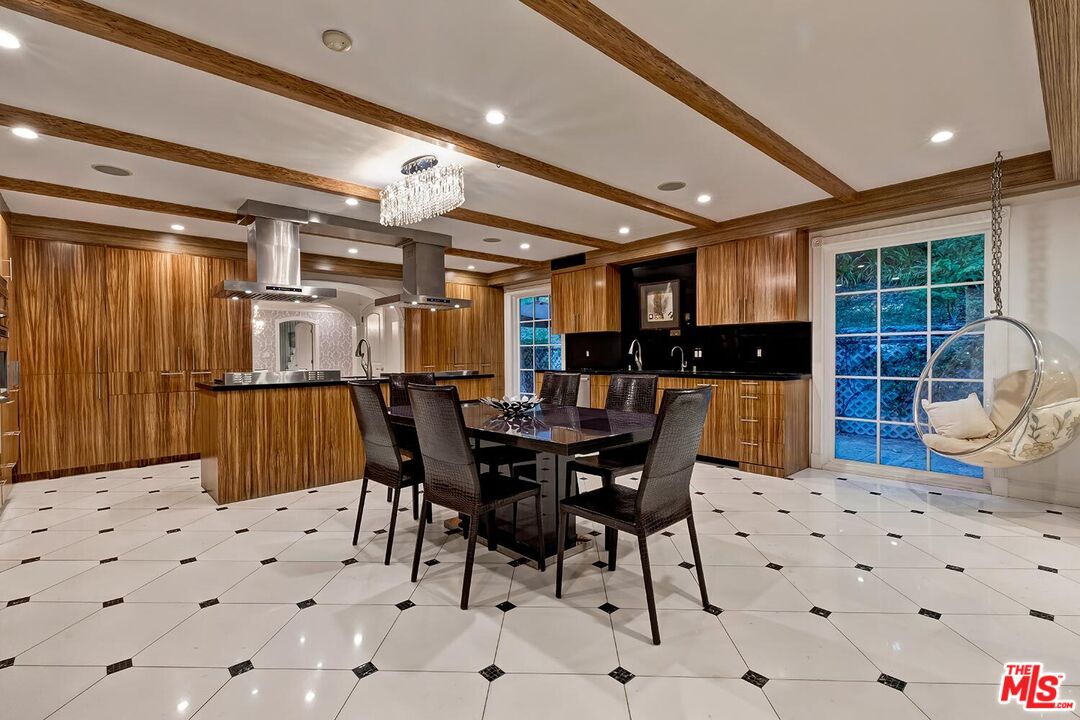 725 North Faring Road Los Angeles, CA 90077 - Photo 18 of 56 a view of a dining area with furniture
