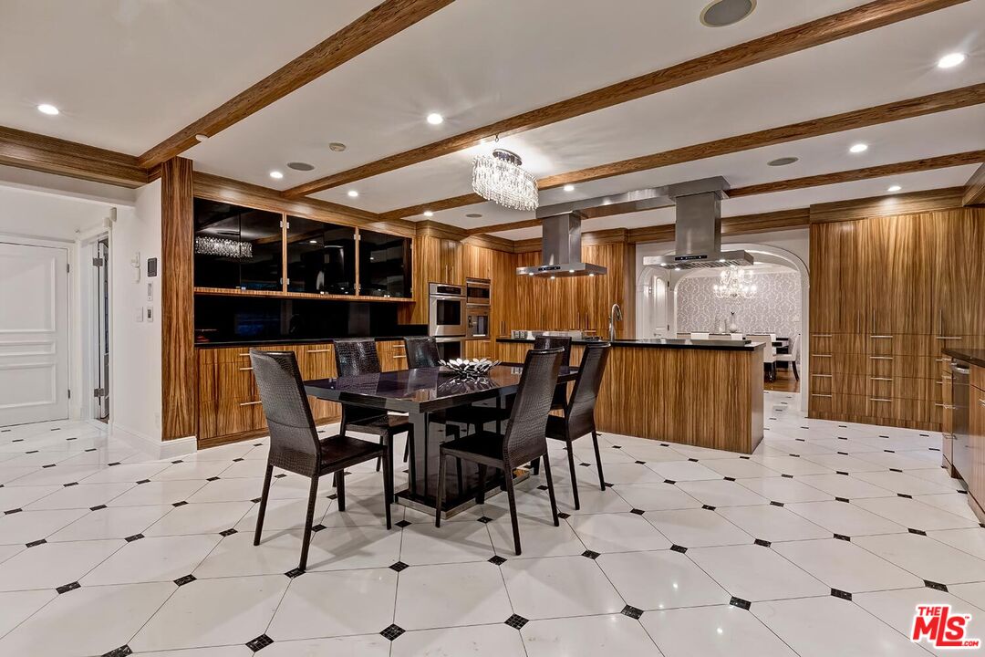 725 North Faring Road Los Angeles, CA 90077 - Photo 19 of 56 a view of a dining area with furniture