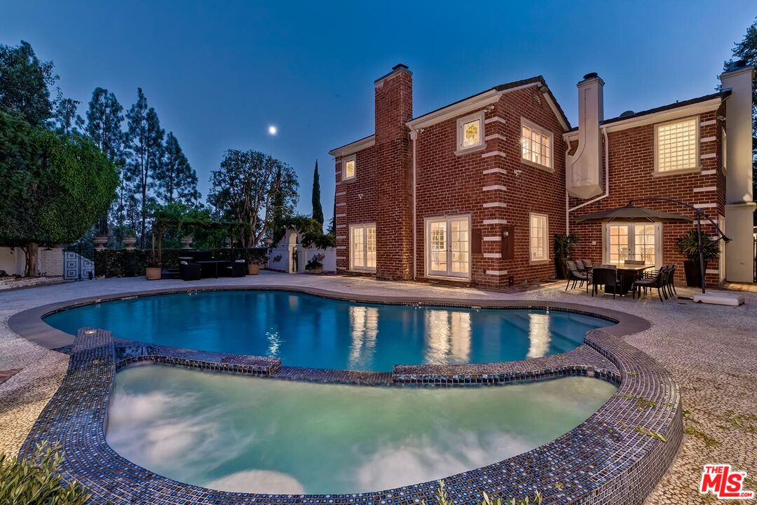 725 North Faring Road Los Angeles, CA 90077 - Photo 26 of 56 a view of a house with swimming pool