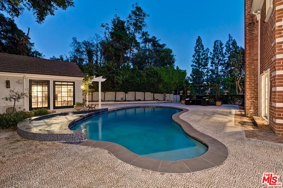 725 North Faring Road Los Angeles, CA 90077 - Photo 29 of 56 a view of a house with swimming pool