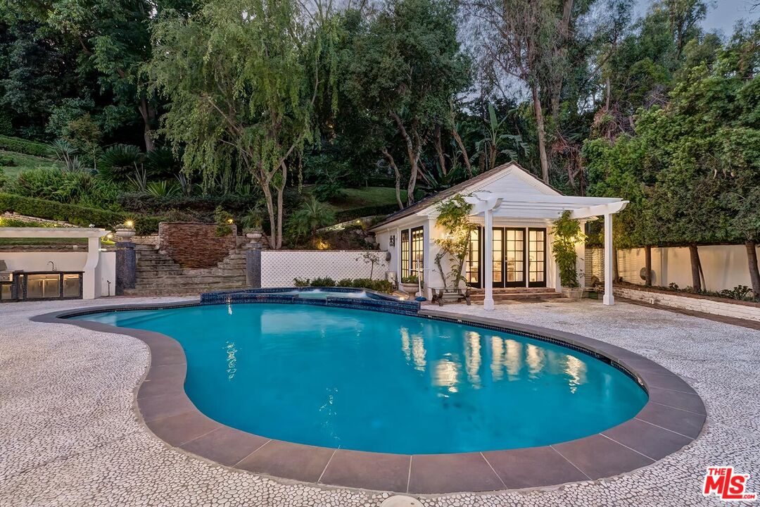 725 North Faring Road Los Angeles, CA 90077 - Photo 31 of 56 a view of a swimming pool with lounge chair