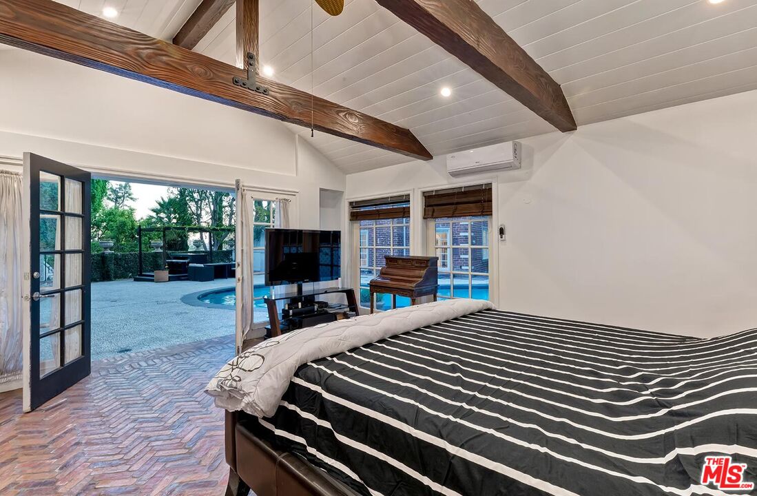 725 North Faring Road Los Angeles, CA 90077 - Photo 32 of 56 a view of a living room and a floor to ceiling window