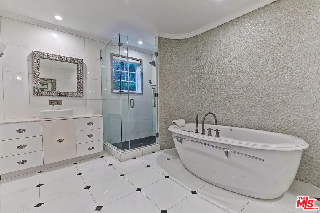 725 North Faring Road Los Angeles, CA 90077 - Photo 45 of 56 a bathroom with a sink a toilet and shower