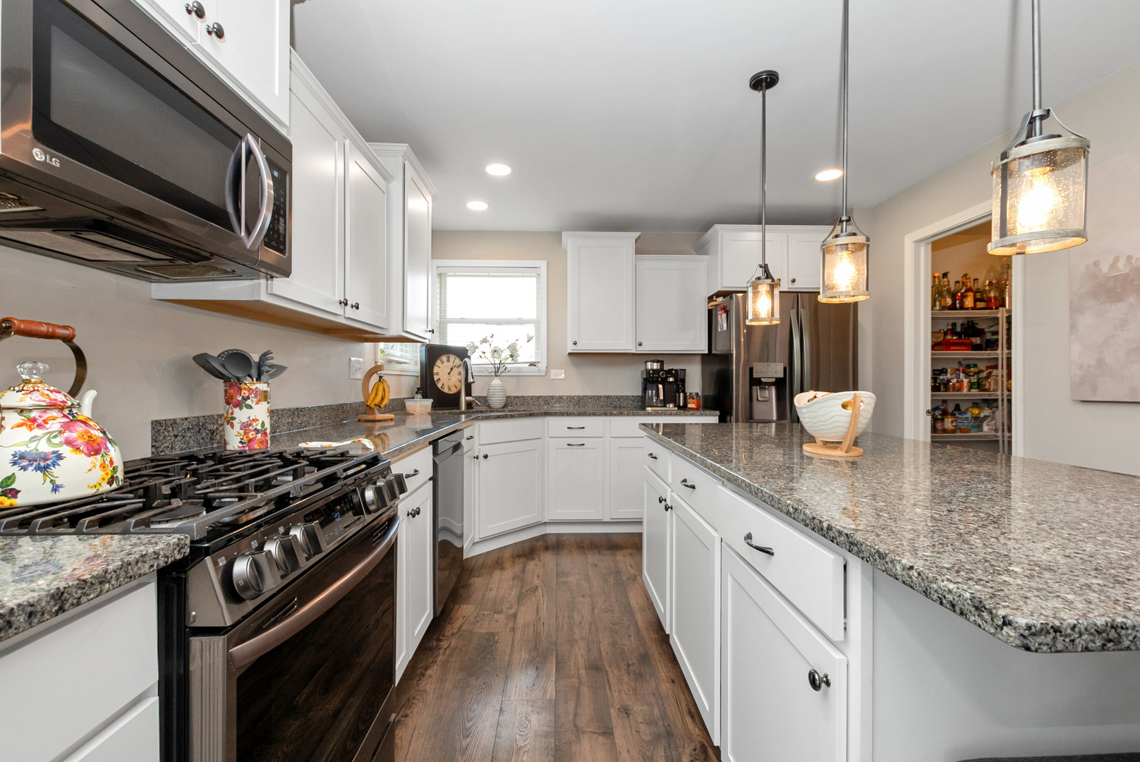 1981 Stapleton Road New Lenox, IL 60451 - Photo 12 of 33 a kitchen with stainless steel appliances granite countertop a stove a sink and a microwave