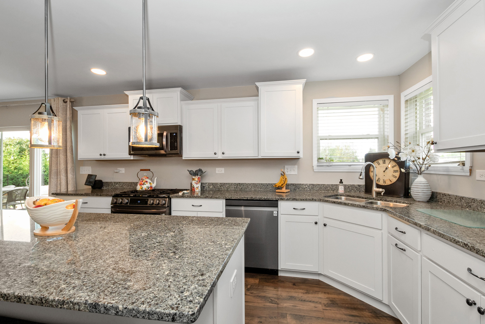 1981 Stapleton Road New Lenox, IL 60451 - Photo 13 of 33 a kitchen with stainless steel appliances granite countertop a sink stove and cabinets