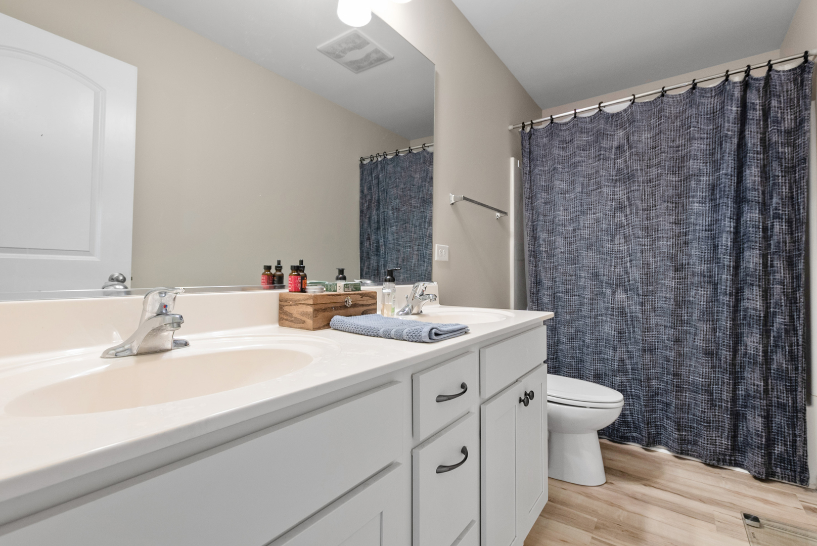 1981 Stapleton Road New Lenox, IL 60451 - Photo 21 of 33 a bathroom with a double vanity sink toilet and a mirror