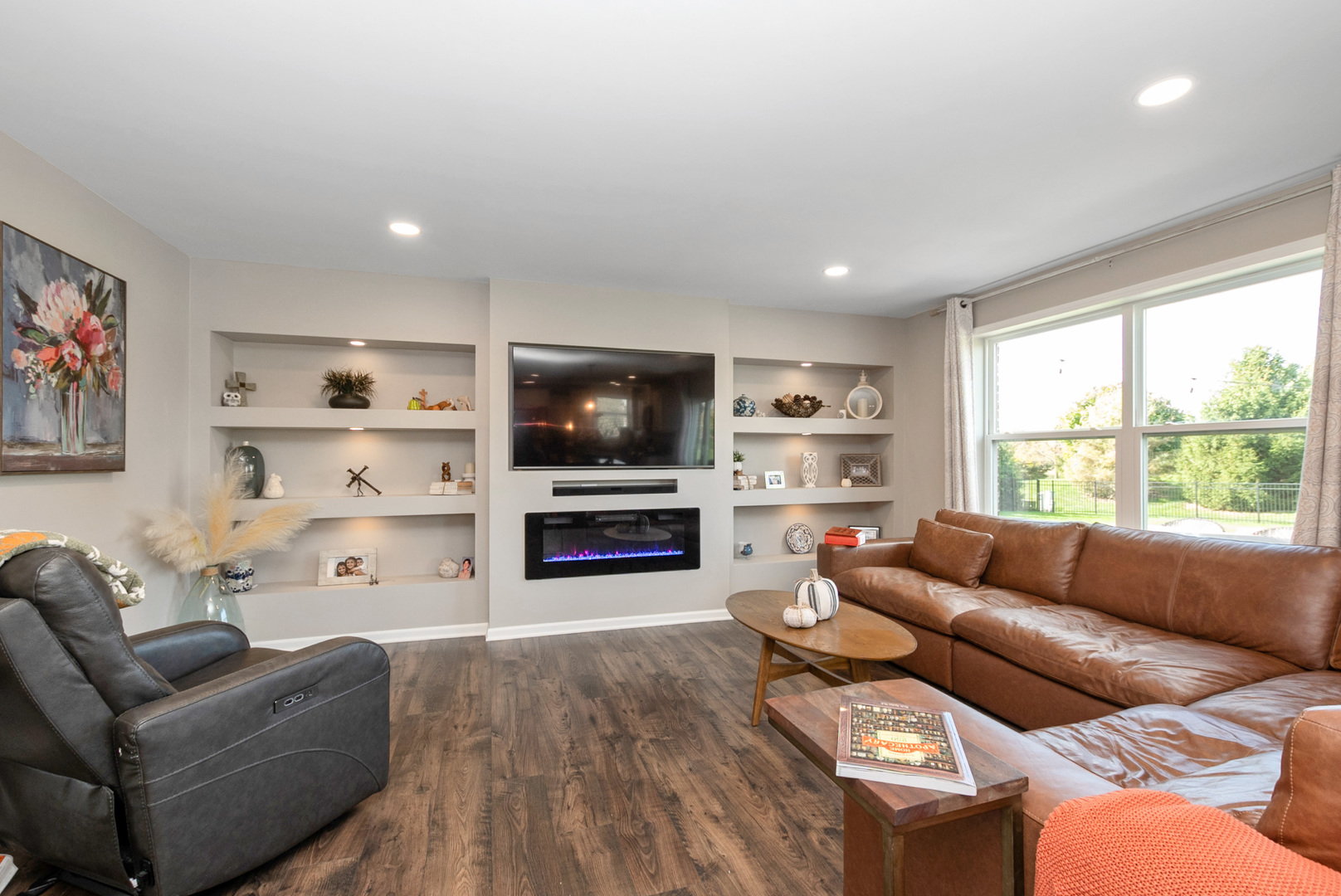 1981 Stapleton Road New Lenox, IL 60451 - Photo 8 of 33 a living room with furniture cabinets and a flat screen tv