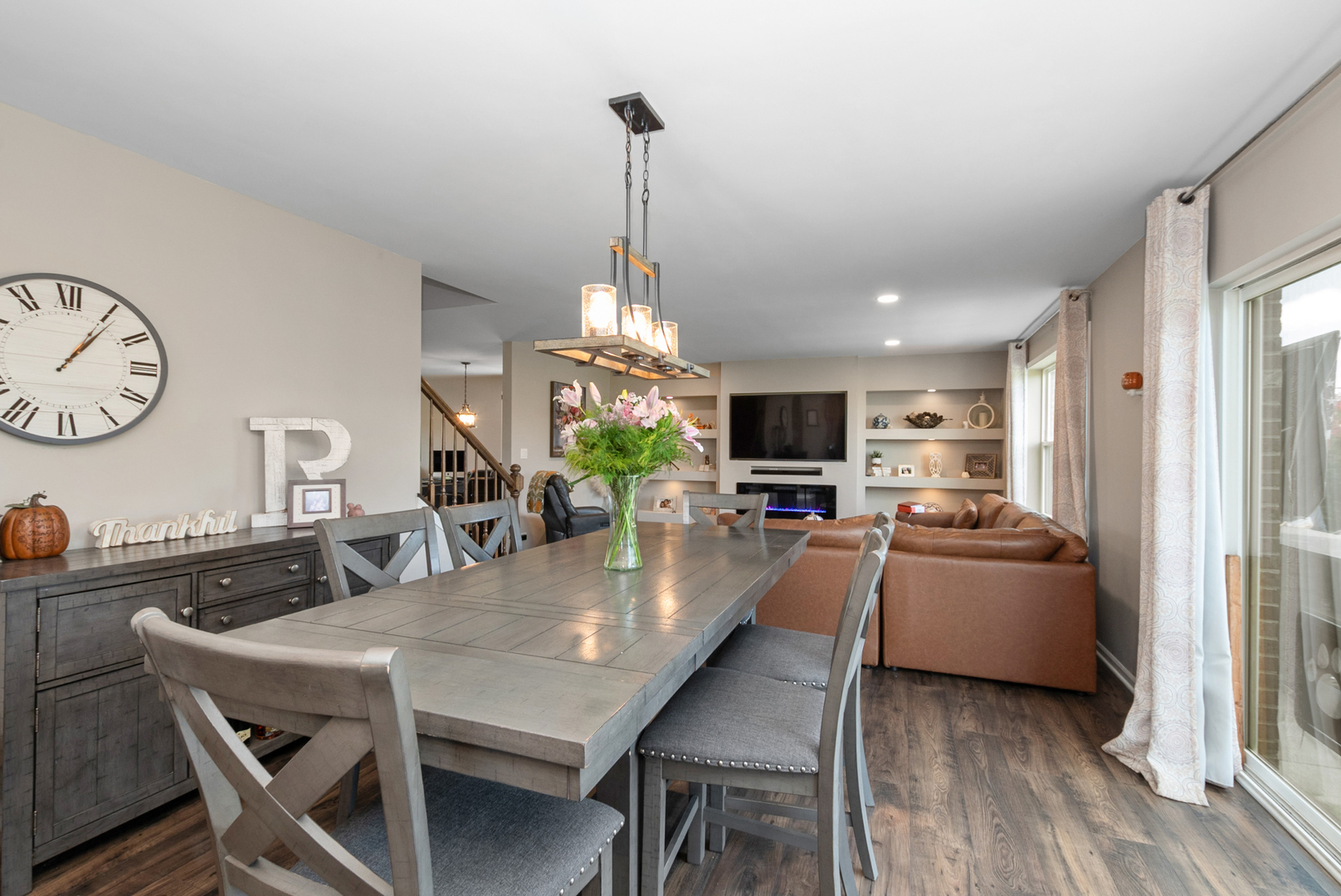 1981 Stapleton Road New Lenox, IL 60451 - Photo 9 of 33 a view of a dining room and livingroom with furniture wooden floor a chandelier