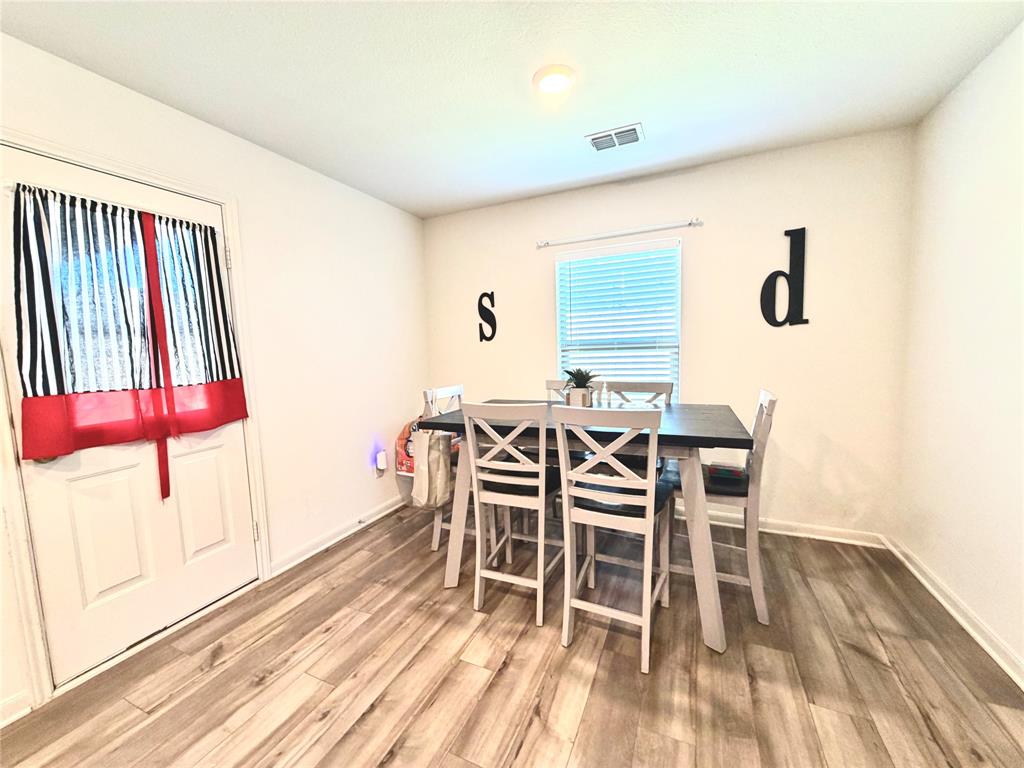 13604 Mineral Road Ponder, TX 76259 - Photo 7 of 20 Dining space with wood finished floors and baseboards