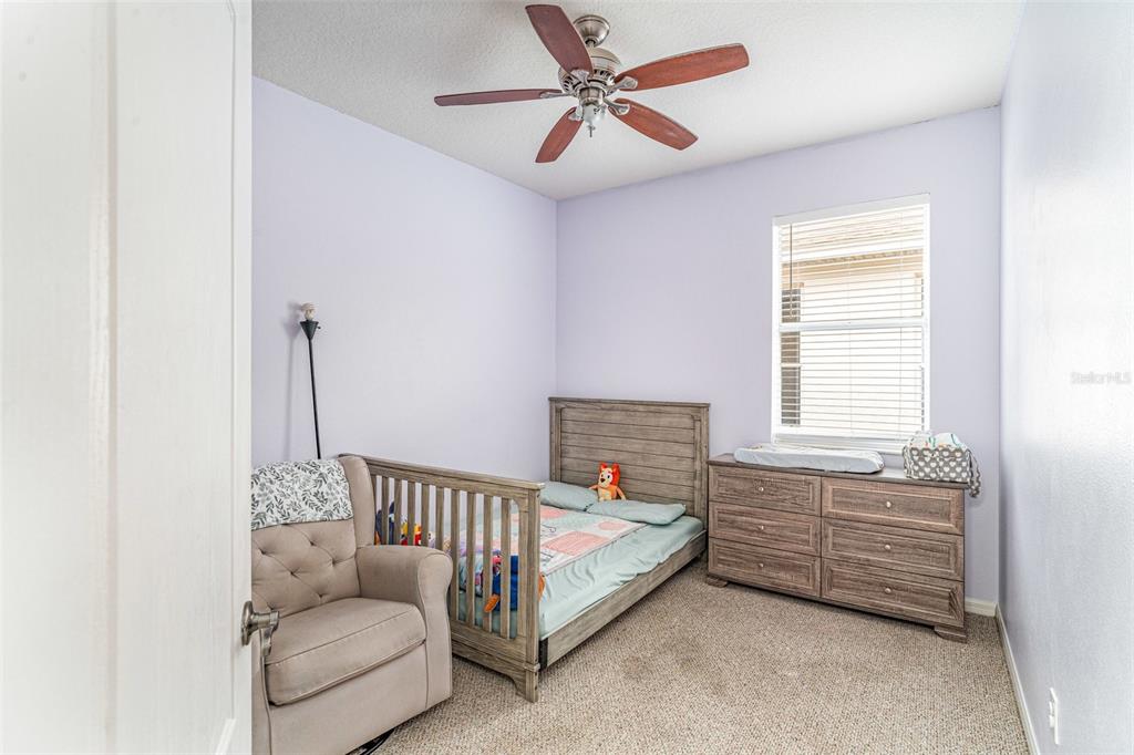 13612 Sigler Street Riverview, FL 33579 - Photo 23 of 31 a bed room with a bed and a window