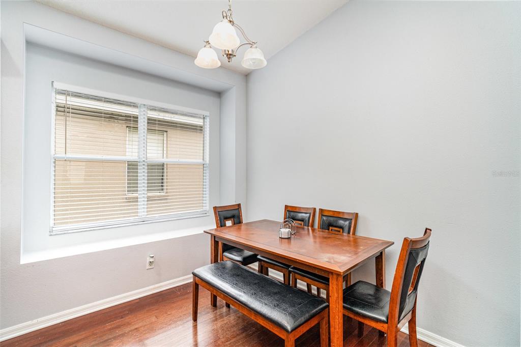 13612 Sigler Street Riverview, FL 33579 - Photo 8 of 31 a view of a workspace with furniture and a window