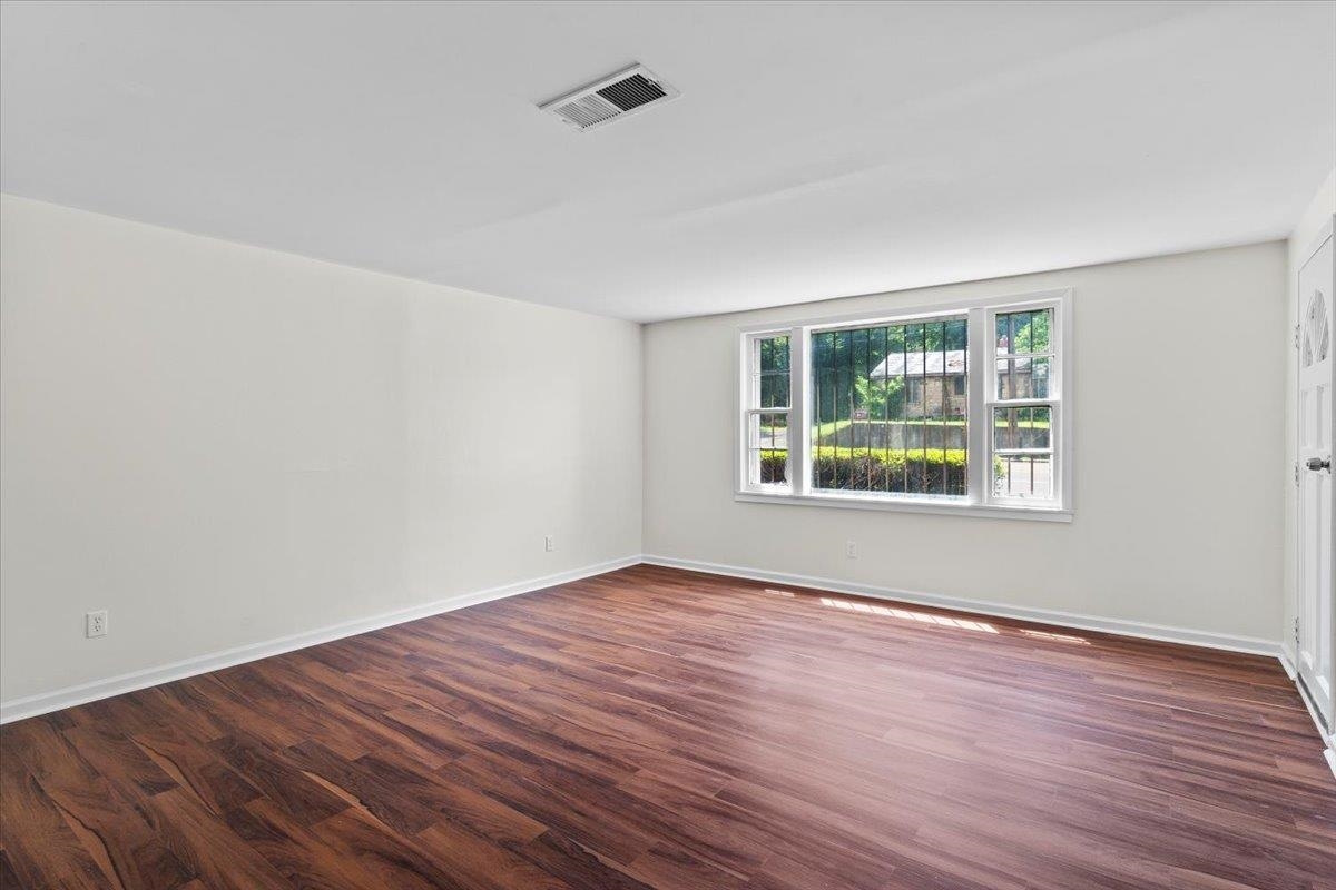 3590 Weaver Road Memphis, TN 38109 - Photo 11 of 23 Unfurnished room with wood finished floors and baseboards