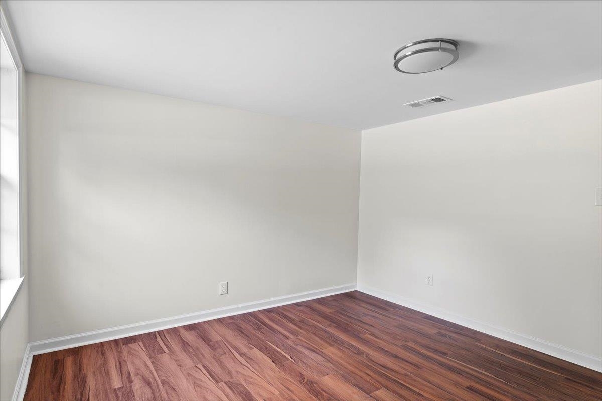 3590 Weaver Road Memphis, TN 38109 - Photo 19 of 23 Empty room with wood finished floors and baseboards
