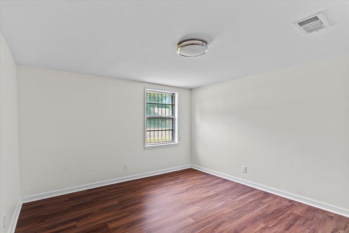 3590 Weaver Road Memphis, TN 38109 - Photo 20 of 23 Empty room with dark wood finished floors