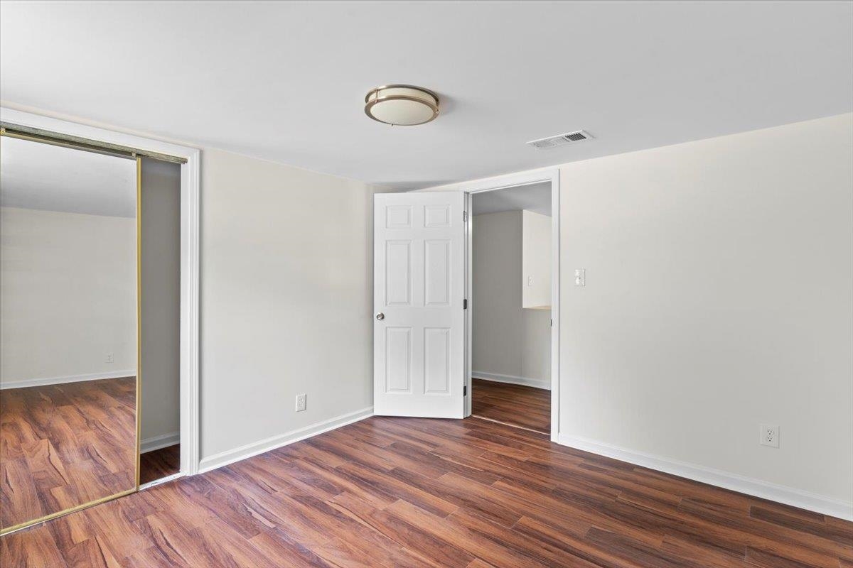 3590 Weaver Road Memphis, TN 38109 - Photo 5 of 23 Unfurnished bedroom featuring wood finished floors and a closet