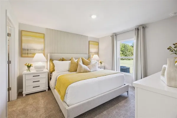 a bedroom with a bed and window