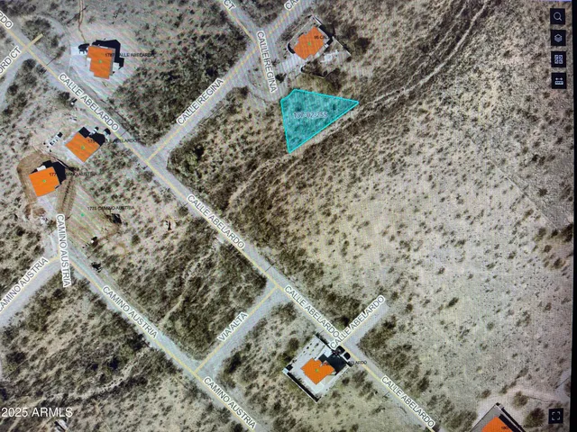 a aerial view of a house with a yard