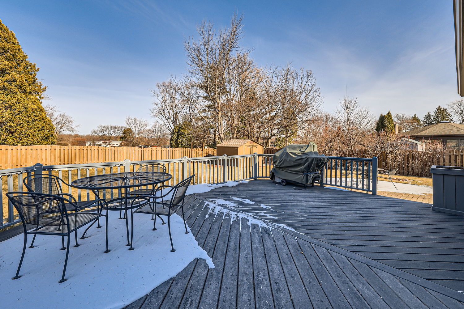 620 Morningside Point Elgin, IL 60123 - Photo 29 of 32 a view of a roof deck with table and chairs a barbeque with wooden floor and fence