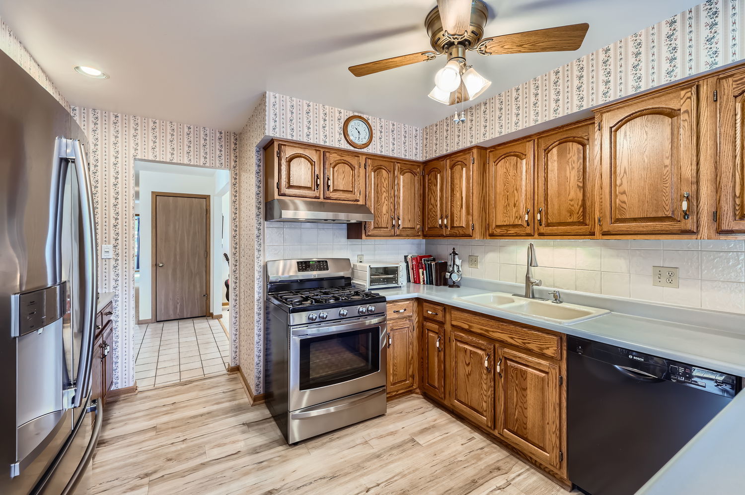 620 Morningside Point Elgin, IL 60123 - Photo 9 of 32 a kitchen with cabinets a center island stainless steel appliances and a window