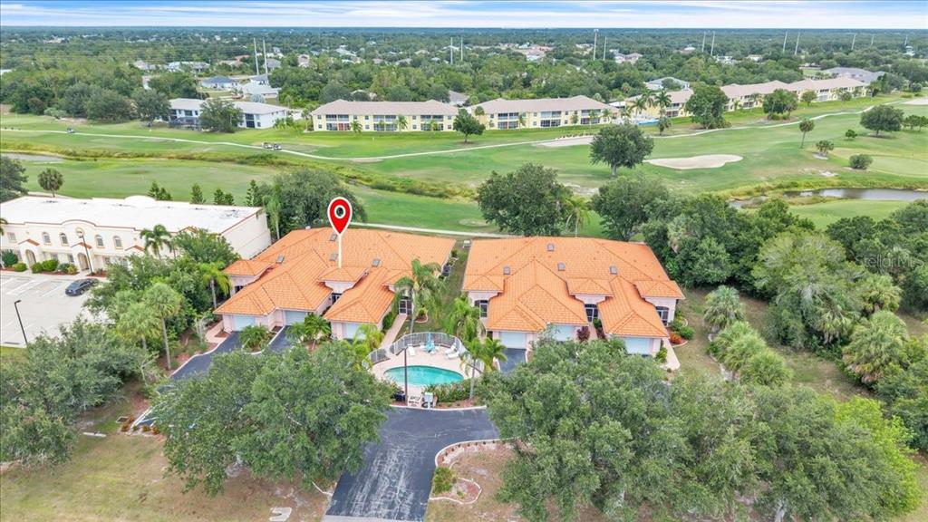 an aerial view of a house with outdoor space and street view