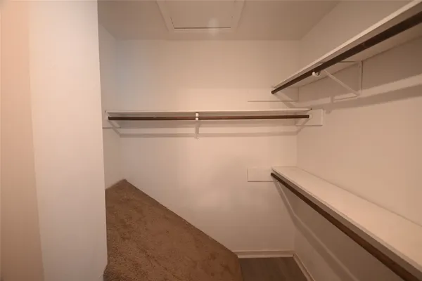 a view of an empty walk in closet