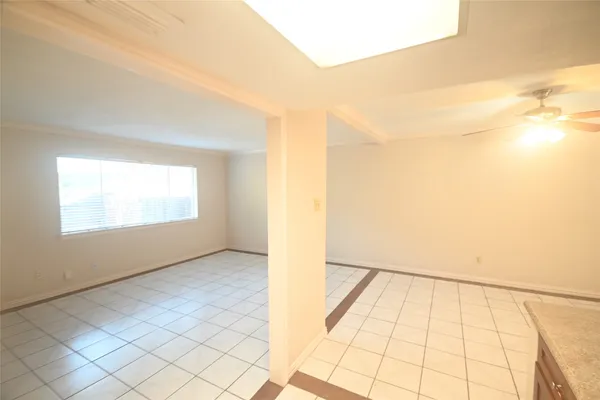 a view of an empty room and window