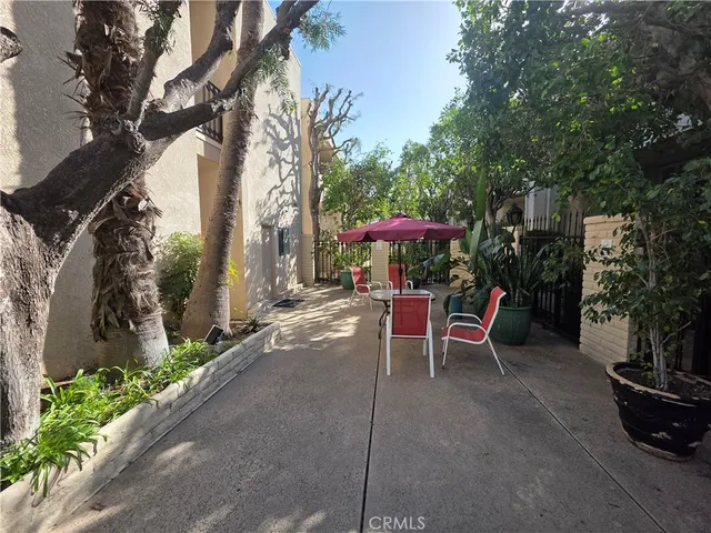 a view of a chairs and tables in the patio