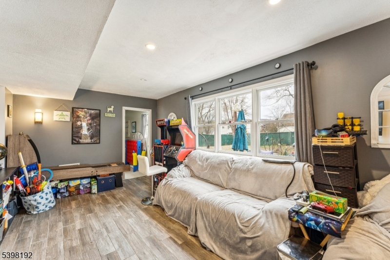 7 Overbrook Road Flanders, NJ 07836 - Photo 15 of 32 a living room with furniture a wooden floor and a large window