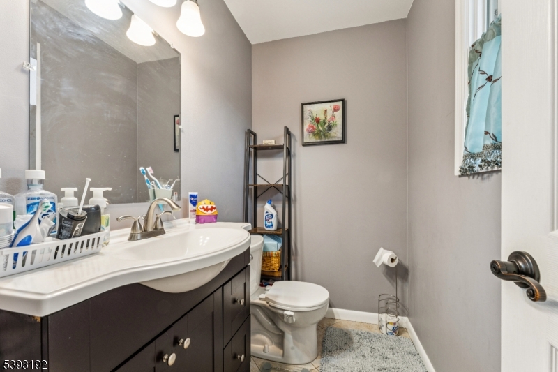 7 Overbrook Road Flanders, NJ 07836 - Photo 22 of 32 a bathroom with a sink vanity mirror and toilet
