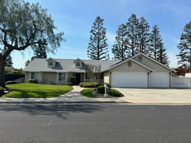 3046 Cypress Avenue Clovis, CA 93611 - Photo 2 of 48 a front view of house with yard and green space