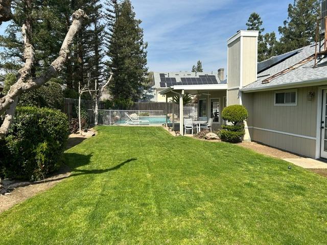 3046 Cypress Avenue Clovis, CA 93611 - Photo 46 of 48 a view of a house with backyard sitting area and garden