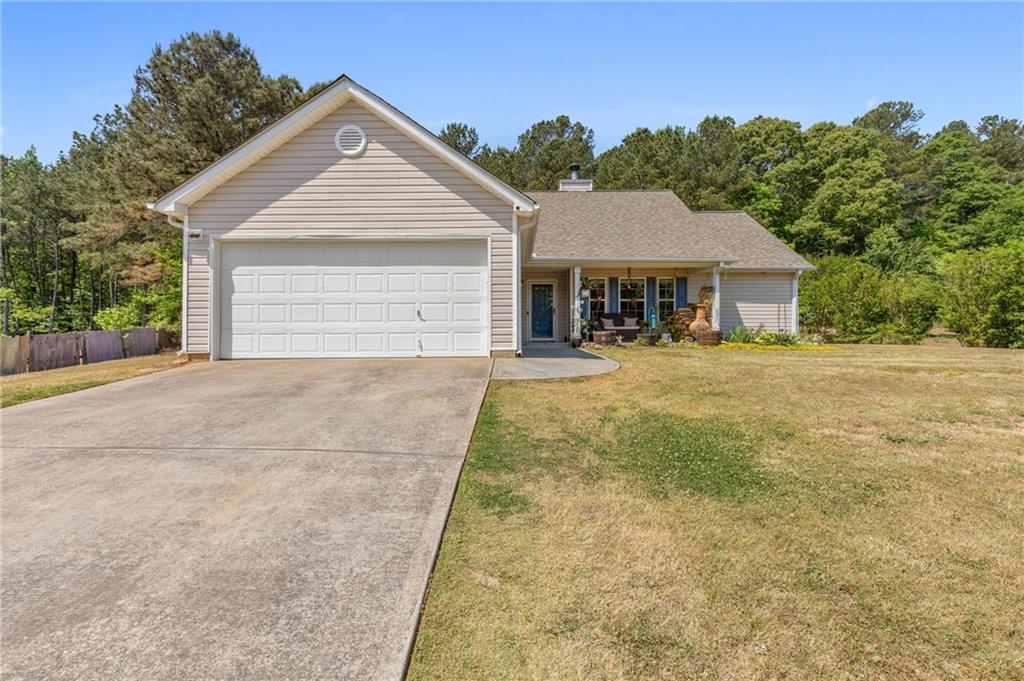 428 Southridge Road Winder, GA 30680 - Photo 1 of 1 a view of a house with a yard and large tree