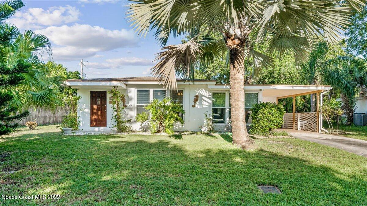 2914 Stetson Street Melbourne, FL 32901 - Photo 1 of 22 a front view of house with yard and green space