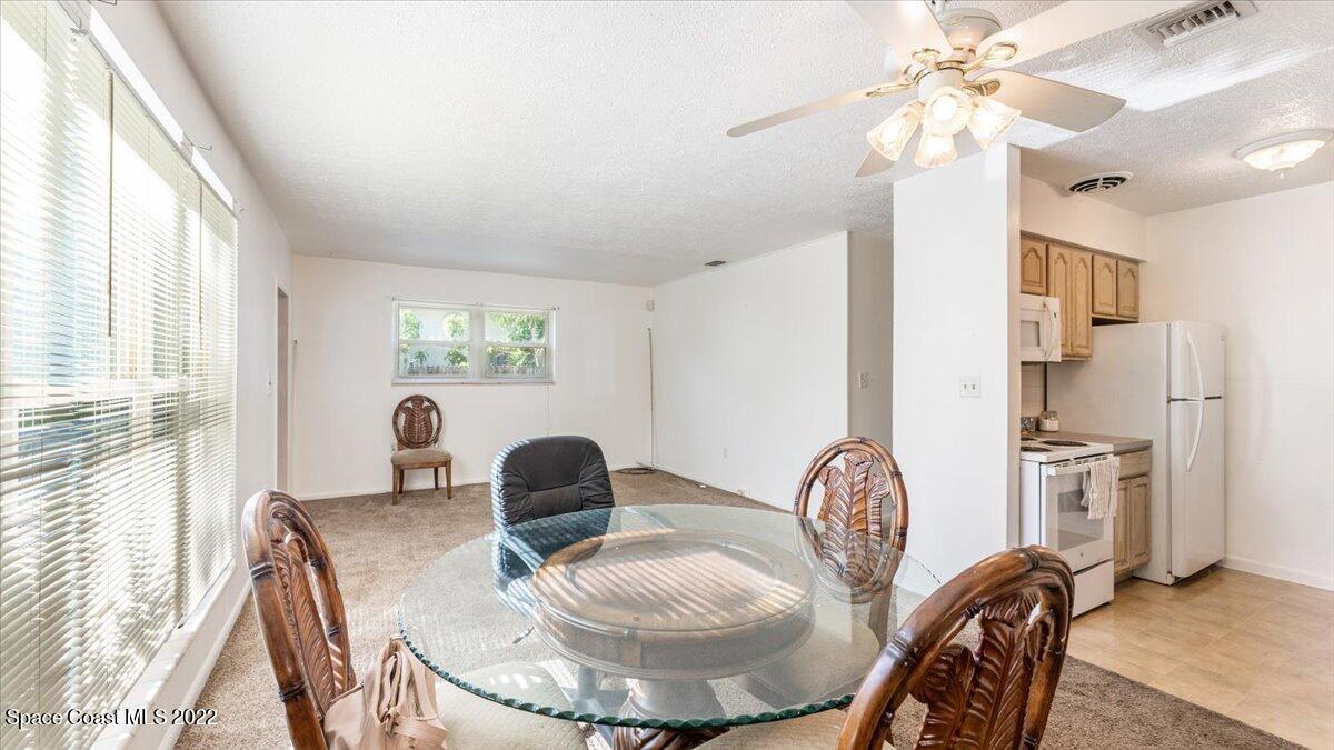 2914 Stetson Street Melbourne, FL 32901 - Photo 12 of 22 a dining room with furniture and window