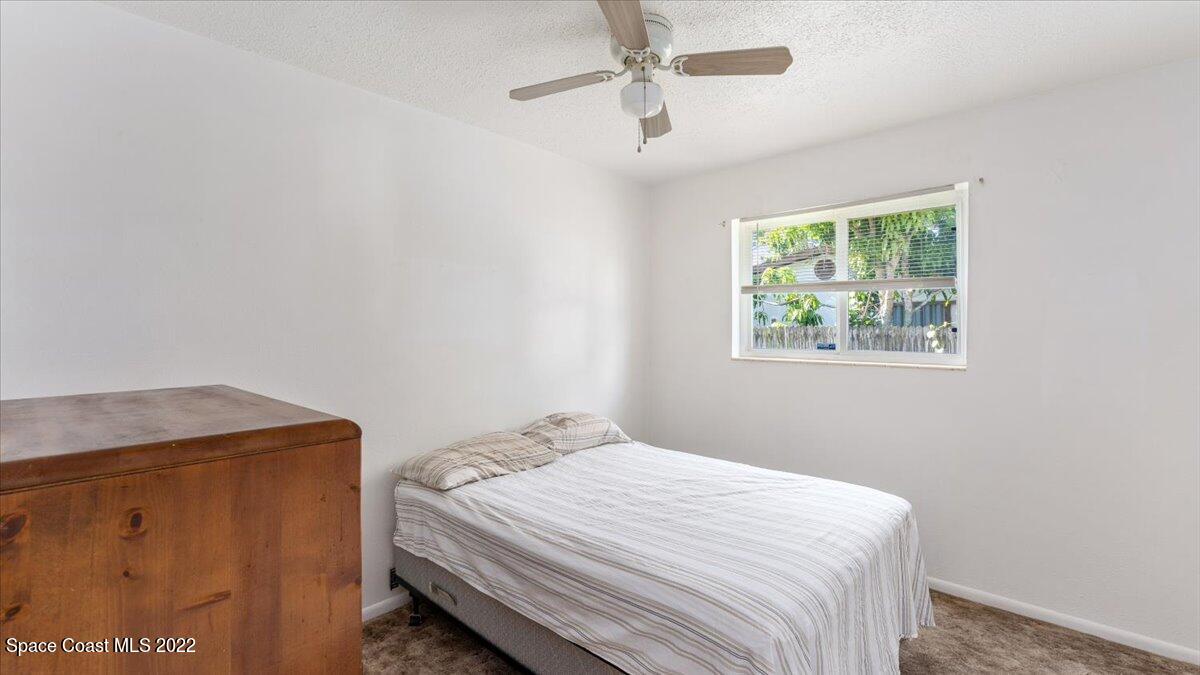 2914 Stetson Street Melbourne, FL 32901 - Photo 13 of 22 a bedroom with a bed and a window