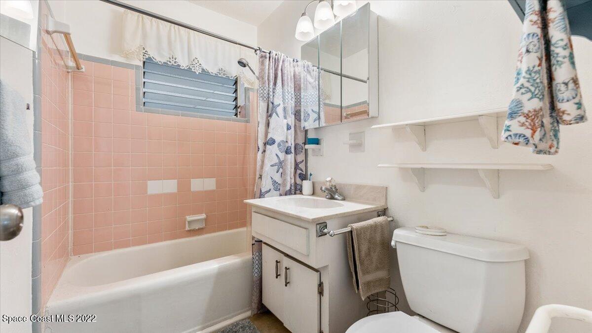 2914 Stetson Street Melbourne, FL 32901 - Photo 19 of 22 a bathroom with a sink toilet and shower