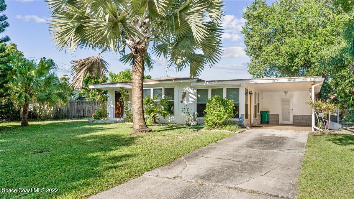 2914 Stetson Street Melbourne, FL 32901 - Photo 2 of 22 a front view of house with yard and green space