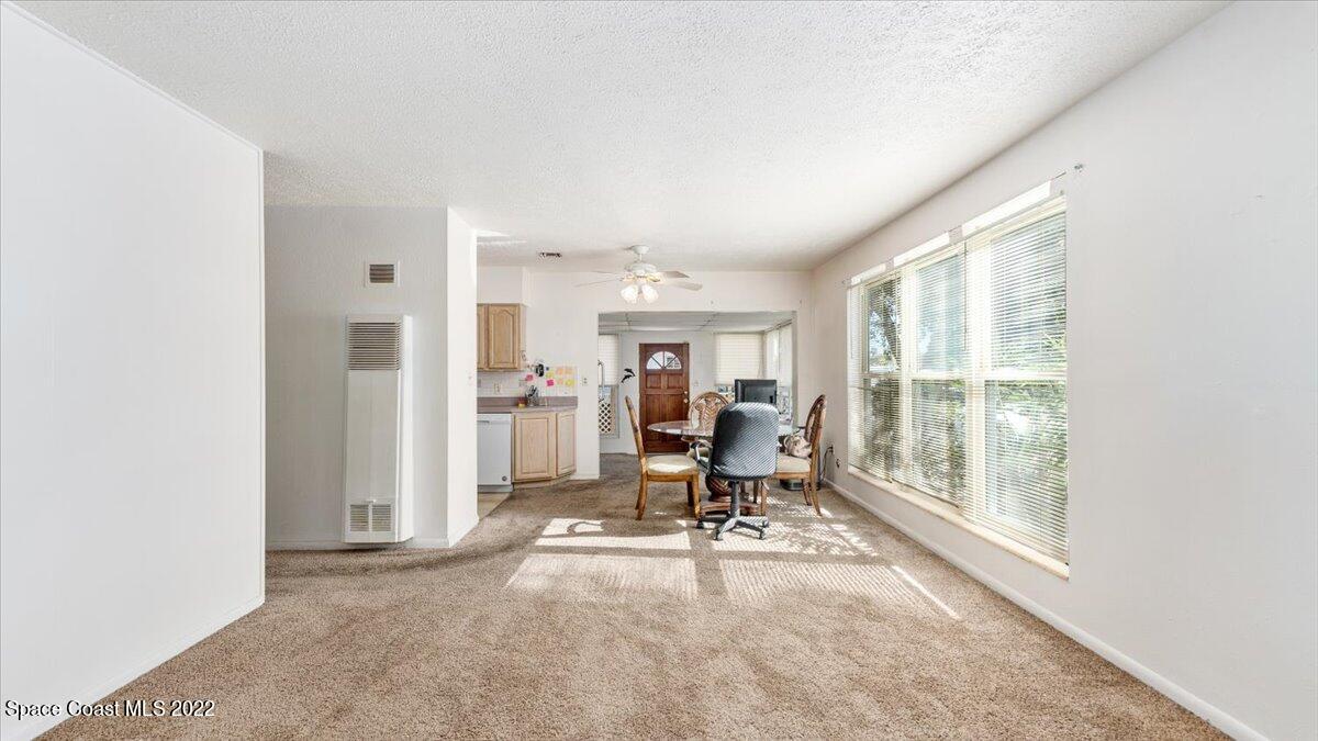 2914 Stetson Street Melbourne, FL 32901 - Photo 8 of 22 a view of a workspace with furniture and a window