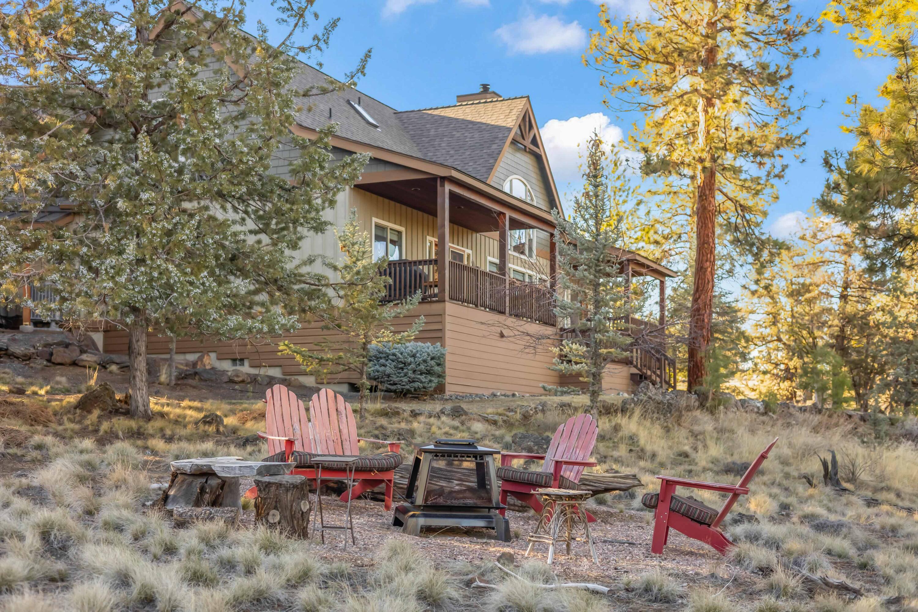 69590 Omaha Road Sisters, OR 97759 - Photo 37 of 46 a backyard of a house with outdoor seating