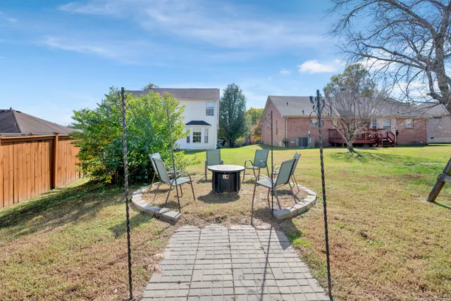 a view of a patio with a table and chairs