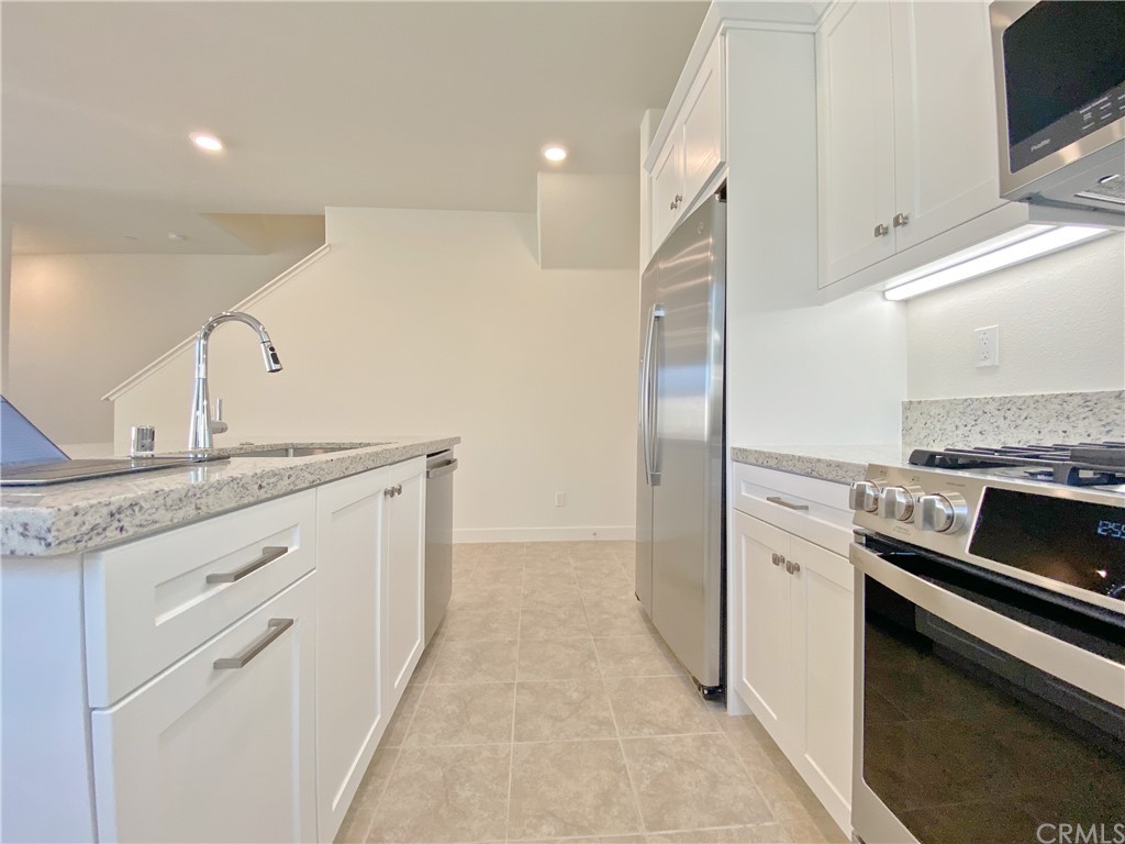35 Bedford Court Arcadia, CA 91007 - Photo 3 of 15 a kitchen with stainless steel appliances granite countertop a refrigerator and a stove