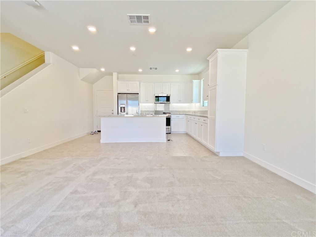 35 Bedford Court Arcadia, CA 91007 - Photo 4 of 15 a view of a kitchen with a sink and a refrigerator